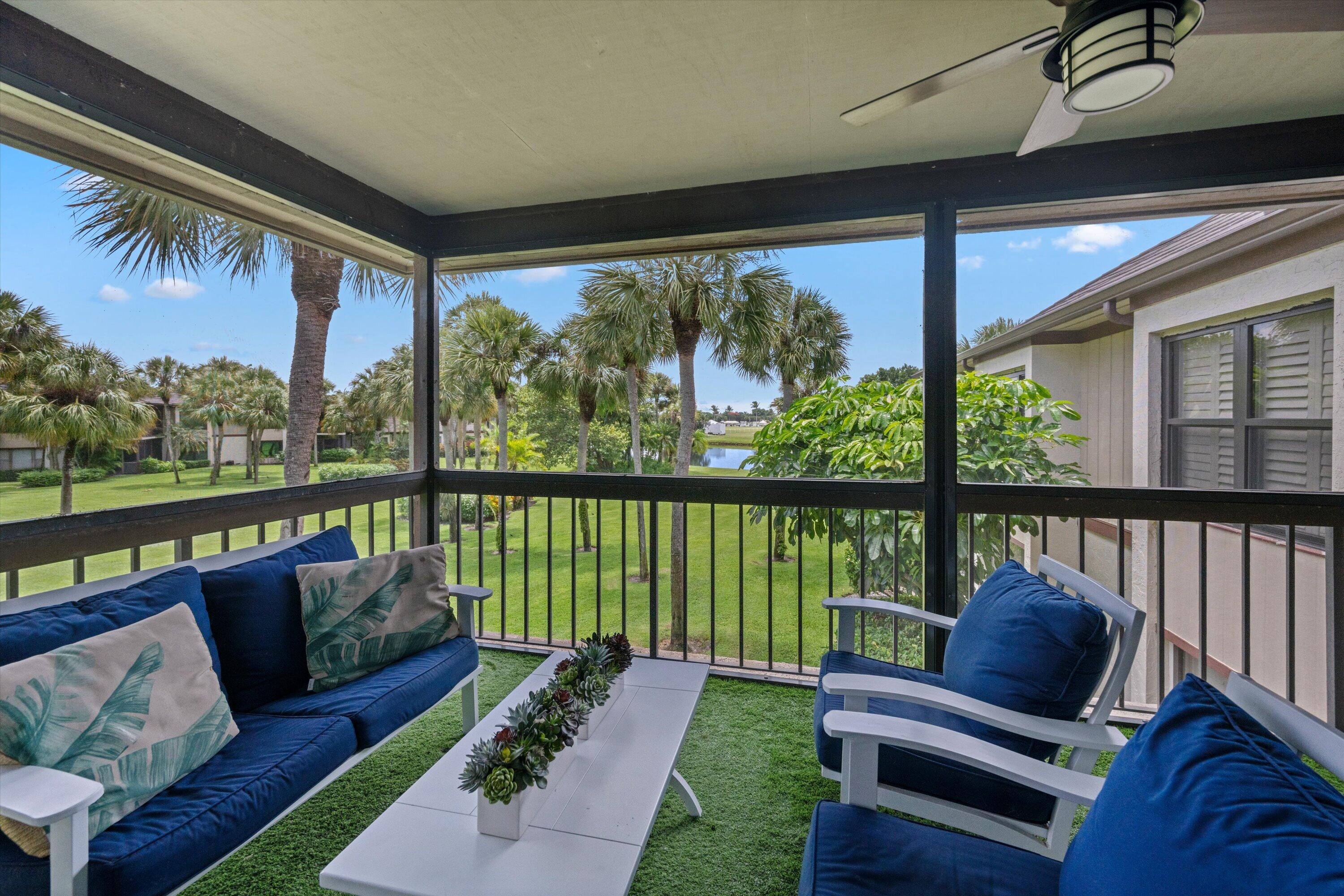 13400 Polo Road West, Unit 203 Wellington, FL 33414 - Photo 7 of 26 a balcony with couch and outdoor view