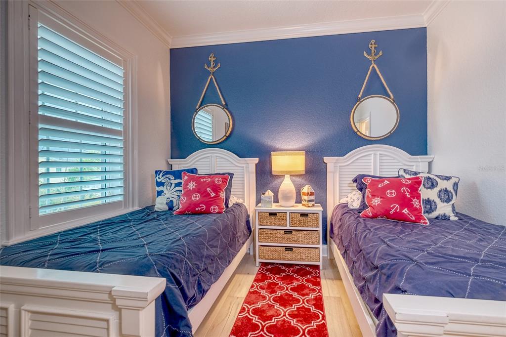 13511 Gulf Boulevard Madeira Beach, FL 33708 - Photo 15 of 30 a bedroom with a bed and window