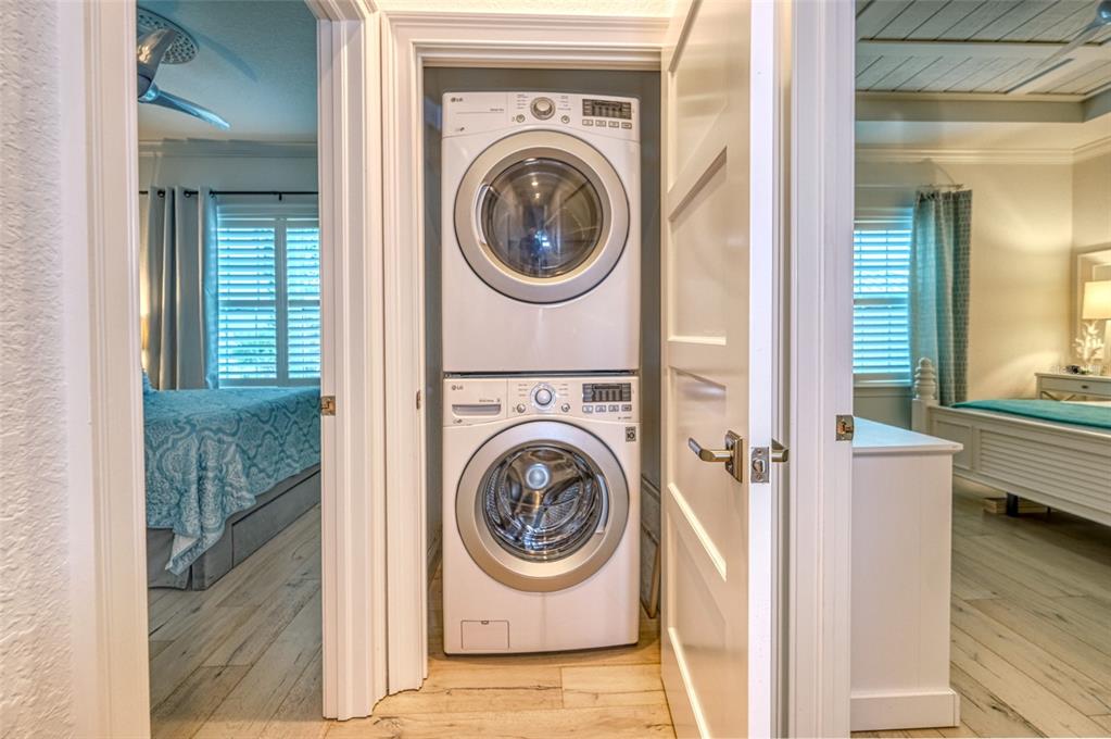 13511 Gulf Boulevard Madeira Beach, FL 33708 - Photo 19 of 30 a utility room with dryer and washer