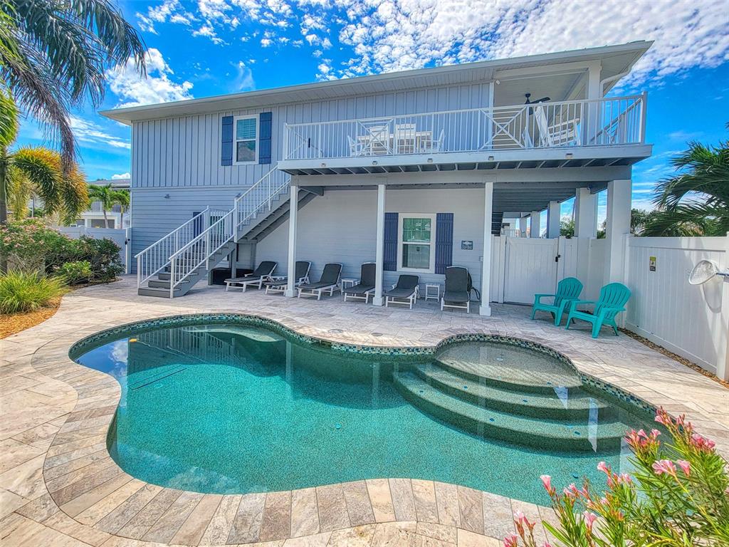 13511 Gulf Boulevard Madeira Beach, FL 33708 - Photo 23 of 30 a view of a house with a swimming pool