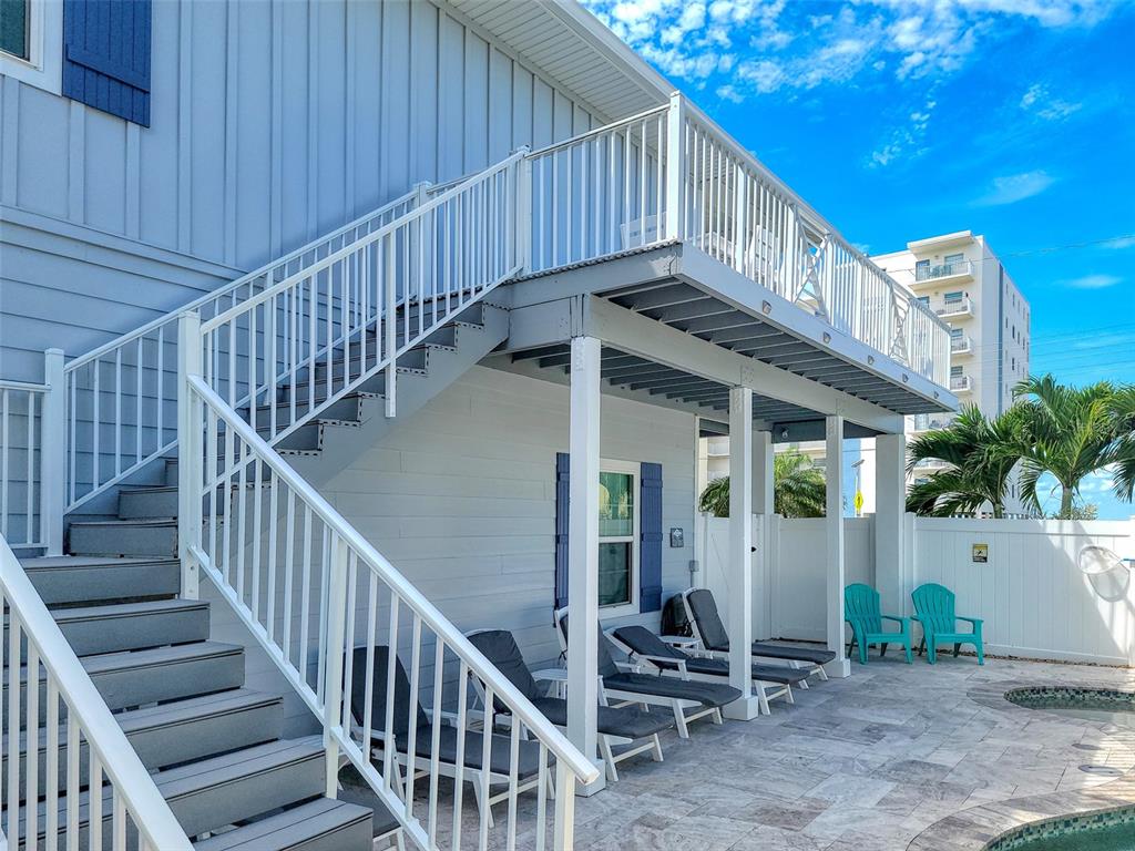 13511 Gulf Boulevard Madeira Beach, FL 33708 - Photo 25 of 30 a view of entryway with wooden stairs