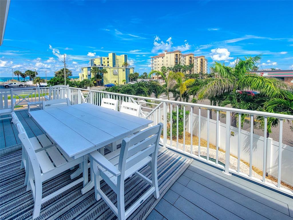 13511 Gulf Boulevard Madeira Beach, FL 33708 - Photo 27 of 30 a view of a balcony with dining area