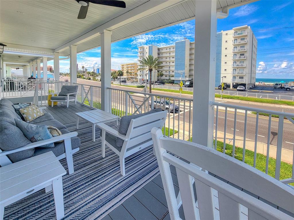 13511 Gulf Boulevard Madeira Beach, FL 33708 - Photo 29 of 30 a view of a living room and balcony with furniture