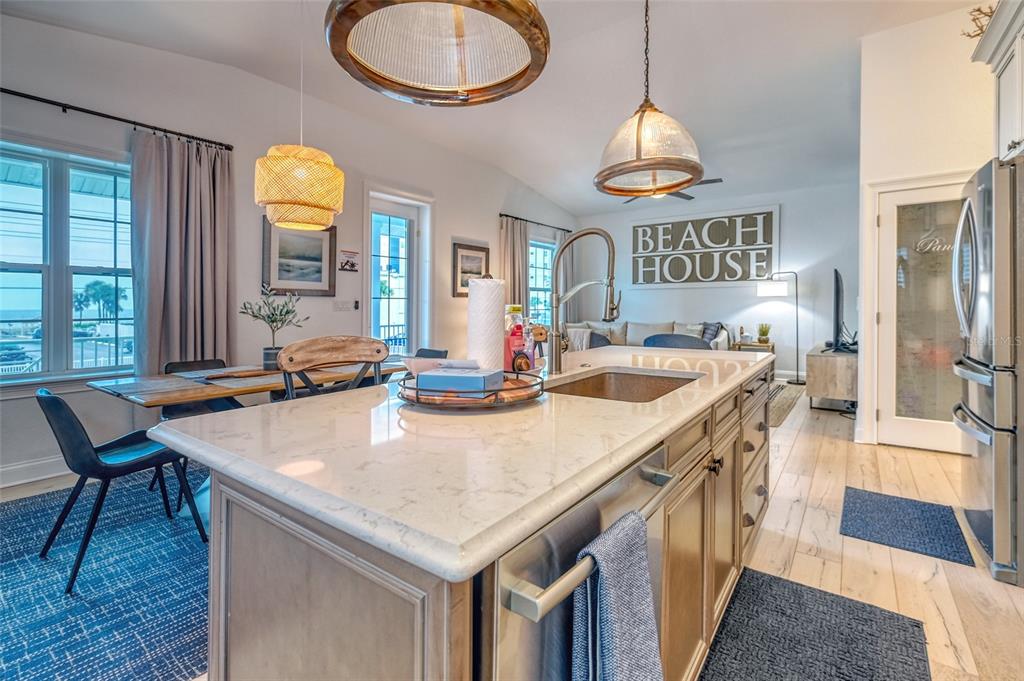 13511 Gulf Boulevard Madeira Beach, FL 33708 - Photo 6 of 30 a view of a dining room with furniture window and wooden floor