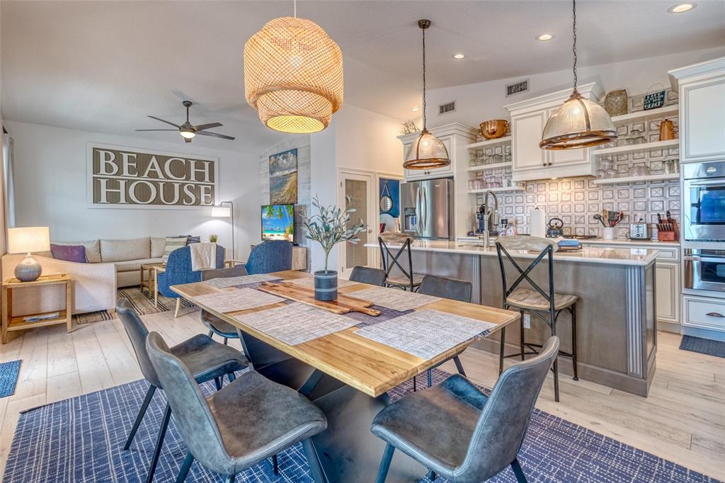 13511 Gulf Boulevard Madeira Beach, FL 33708 - Photo 7 of 30 a view of a dining room with furniture