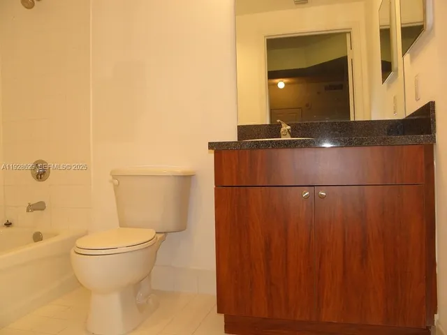 a bathroom with a toilet and a sink