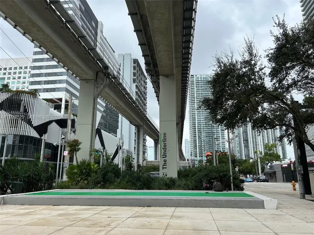 a view of a building with a yard