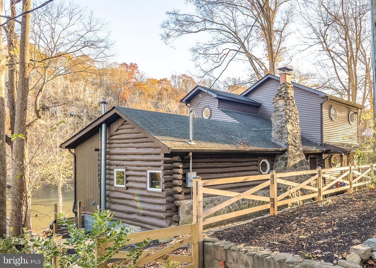 a view of a house with a snow on the road