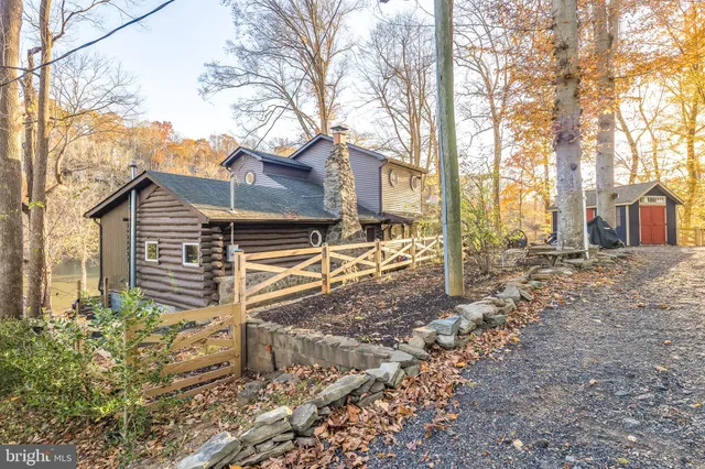 a view of a house with a yard covered in snow