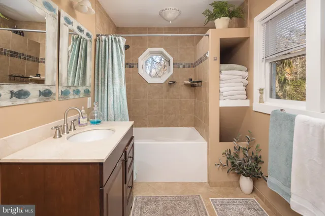 a bathroom with a bath tub and a shower