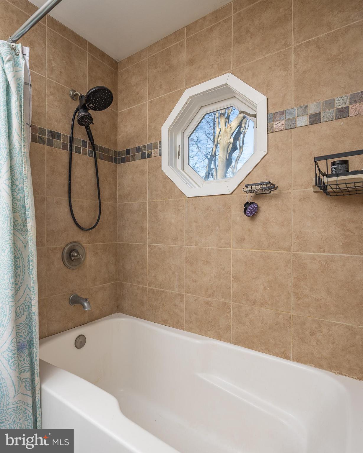 11999 Manning Road Manassas, VA 20112 - Photo 24 of 76 a bathroom with a bath tub and a shower