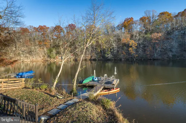 a view of a building with swimming pool and a yard