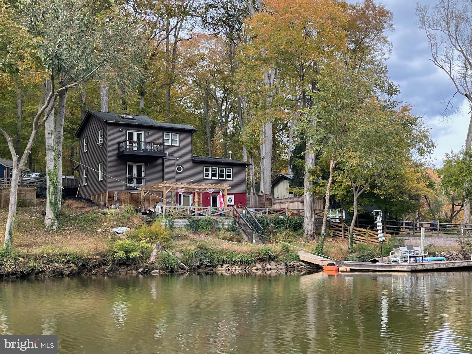 11999 Manning Road Manassas, VA 20112 - Photo 36 of 76 a view of swimming pool with a yard and large trees