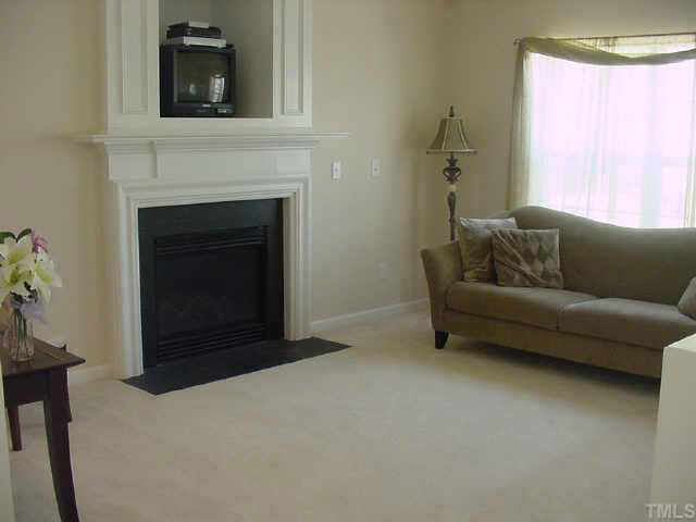 4808 Loganshire Lane Raleigh, NC 27616 - Photo 3 of 10 This spacious greatroom offers a fireplace with gas logs and a media nook!