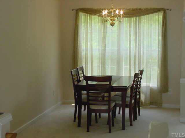 4808 Loganshire Lane Raleigh, NC 27616 - Photo 4 of 10 Your dining room with accommodate large furniture and overlooks the private backyard!
