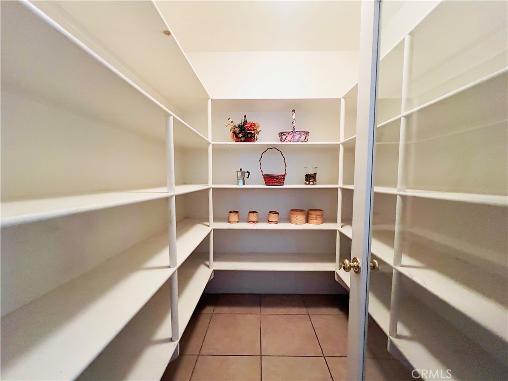 17231 Greentree Drive Riverside, CA 92503 - Photo 15 of 42 a storage room with empty racks