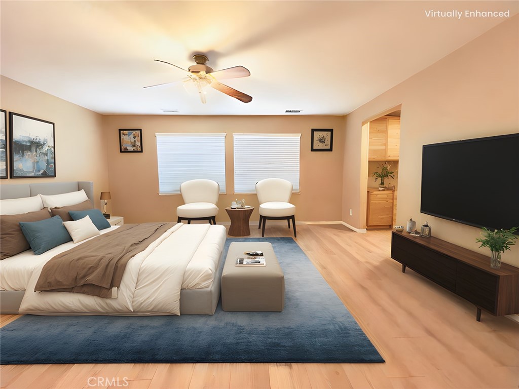 17231 Greentree Drive Riverside, CA 92503 - Photo 17 of 42 a bedroom with a bed window and a flat screen tv