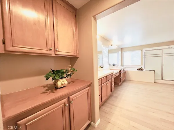a kitchen with a sink and cabinets