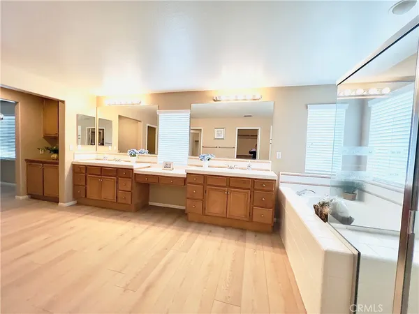 a large kitchen with a sink and cabinets