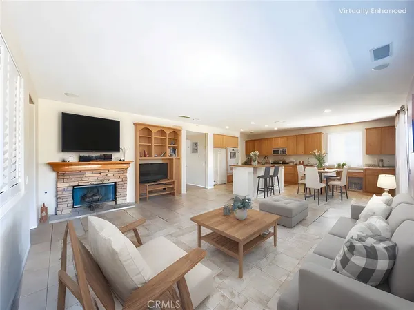 a living room with fireplace furniture and a flat screen tv