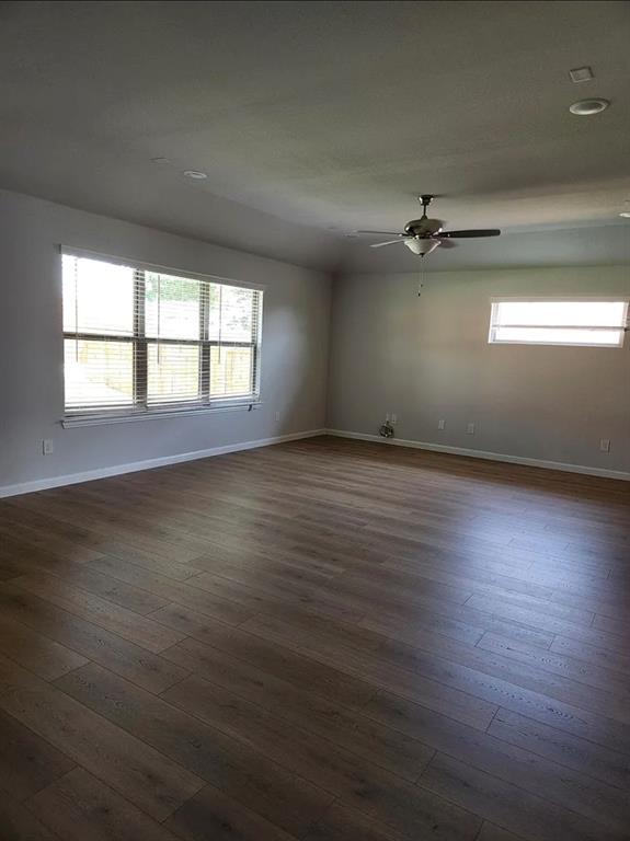 2043 Atlantic Avenue Anna, TX 75409 - Photo 11 of 25 an empty room with wooden floor and windows