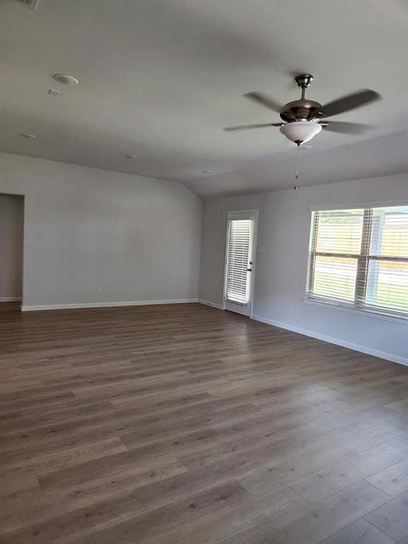 2043 Atlantic Avenue Anna, TX 75409 - Photo 13 of 25 an empty room with wooden floor and windows