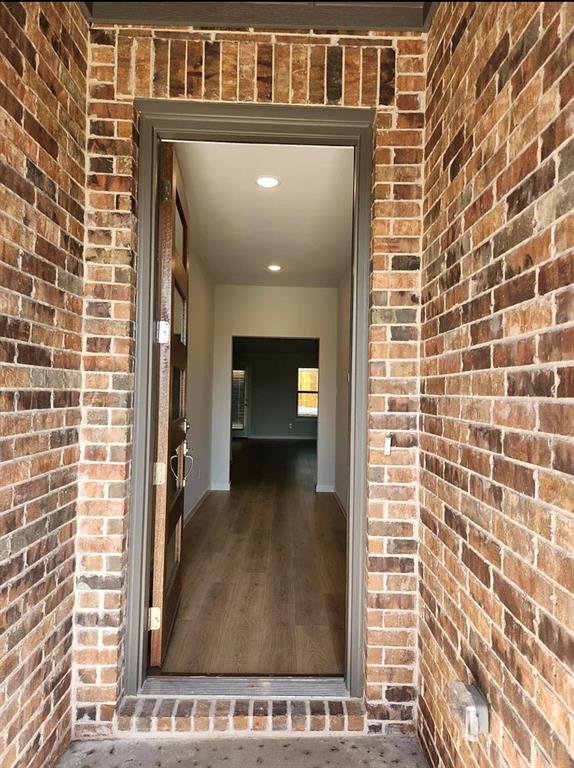2043 Atlantic Avenue Anna, TX 75409 - Photo 2 of 25 a view of a door and brick wall