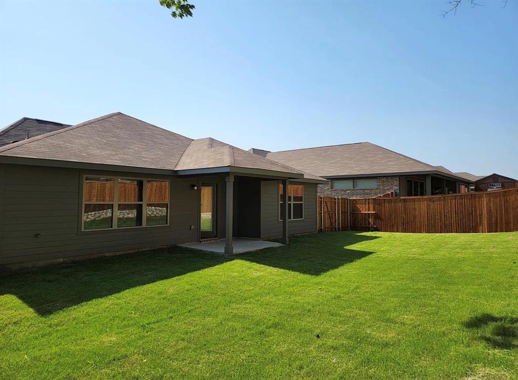 2043 Atlantic Avenue Anna, TX 75409 - Photo 24 of 25 a view of a house with a garden and yard