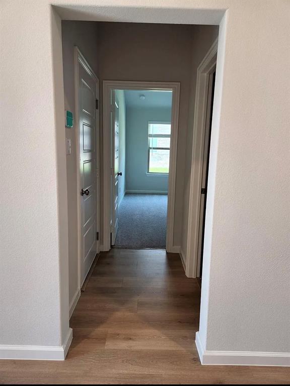 2043 Atlantic Avenue Anna, TX 75409 - Photo 4 of 25 a view of a hallway view with wooden floor and staircase