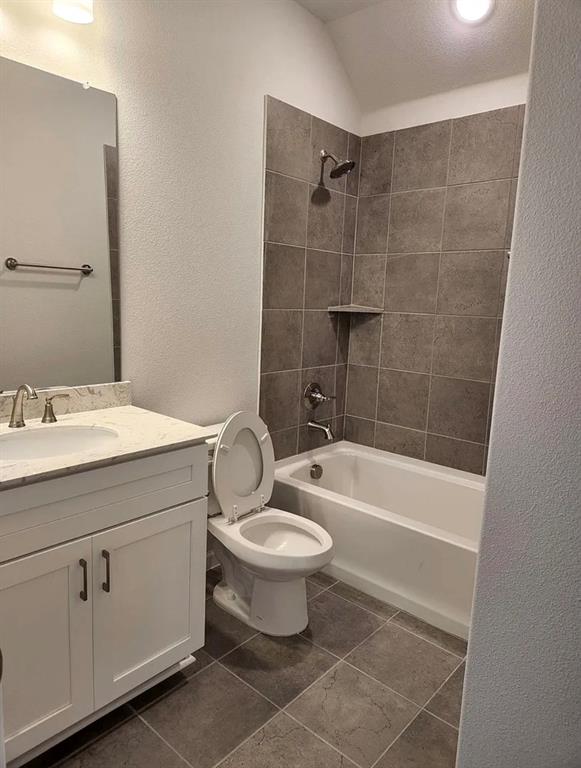 2043 Atlantic Avenue Anna, TX 75409 - Photo 8 of 25 a bathroom with a sink a toilet and a bathtub