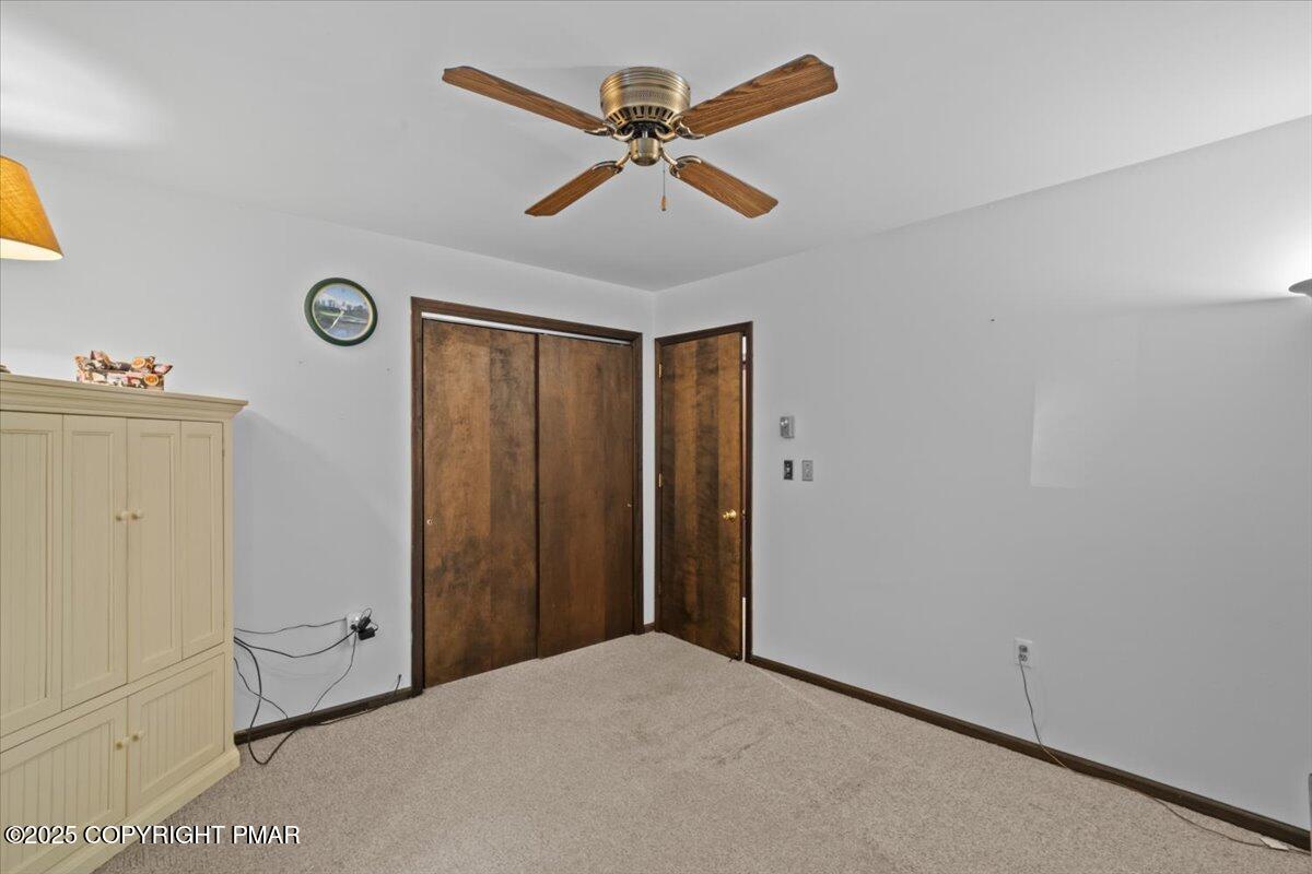 157 Viewtop Road Palmerton, PA 18071 - Photo 11 of 22 a view of a livingroom with a ceiling fan and wooden floor