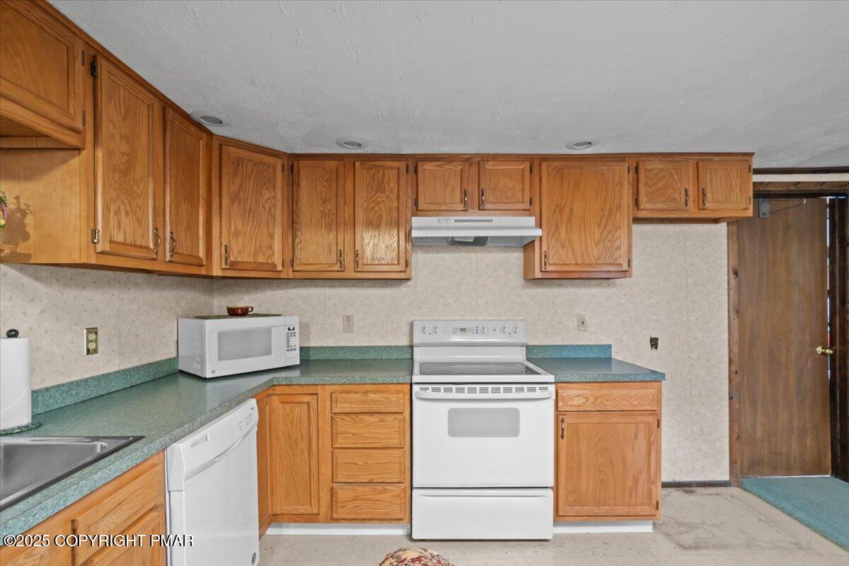 157 Viewtop Road Palmerton, PA 18071 - Photo 15 of 22 a kitchen with stainless steel appliances granite countertop a stove a sink and a white cabinets