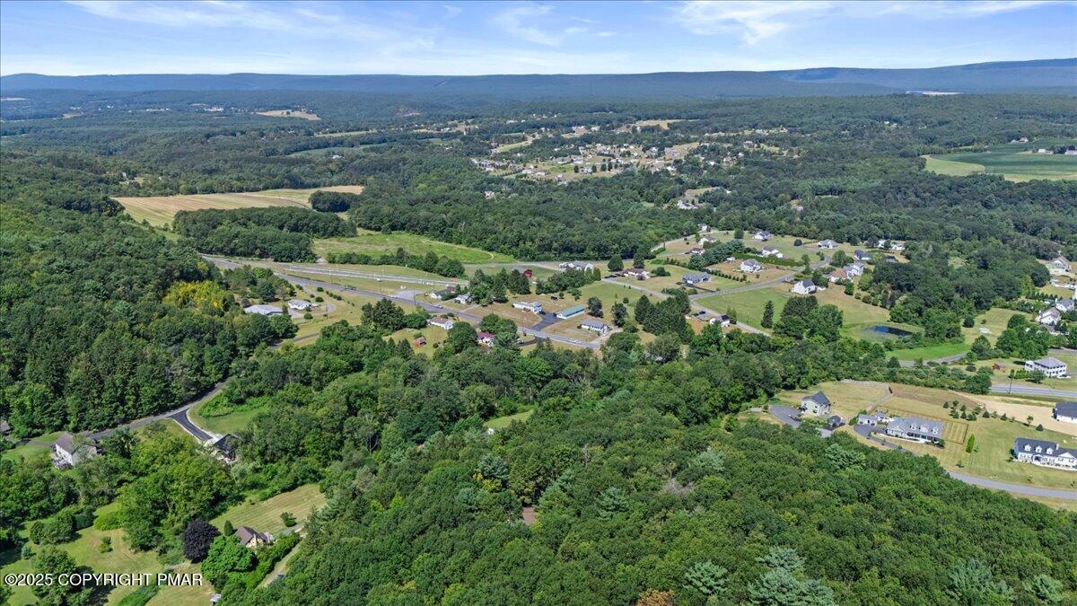 157 Viewtop Road Palmerton, PA 18071 - Photo 3 of 22 an aerial view of a city with lots of residential buildings and mountain view in back
