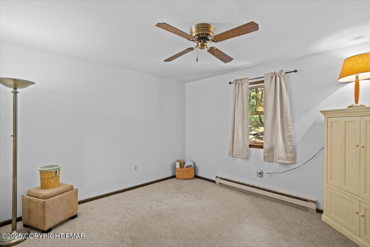 157 Viewtop Road Palmerton, PA 18071 - Photo 10 of 22 a view of a livingroom with wooden floor and a ceiling fan