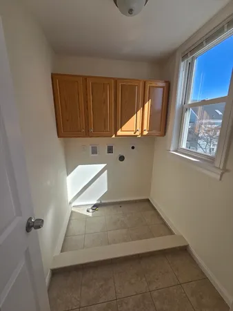 a view of a utility room with window
