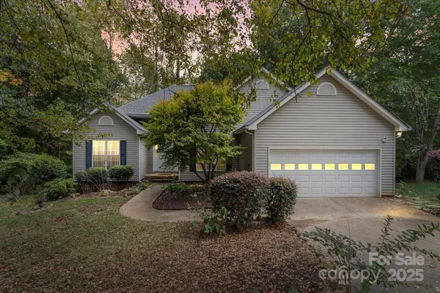 a view of a room with wooden floor and ceiling fan
