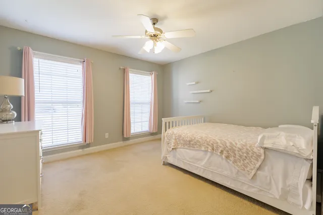 a bedroom with a bed and window
