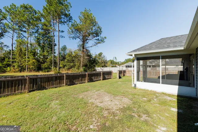 a house with swimming pool in front of it
