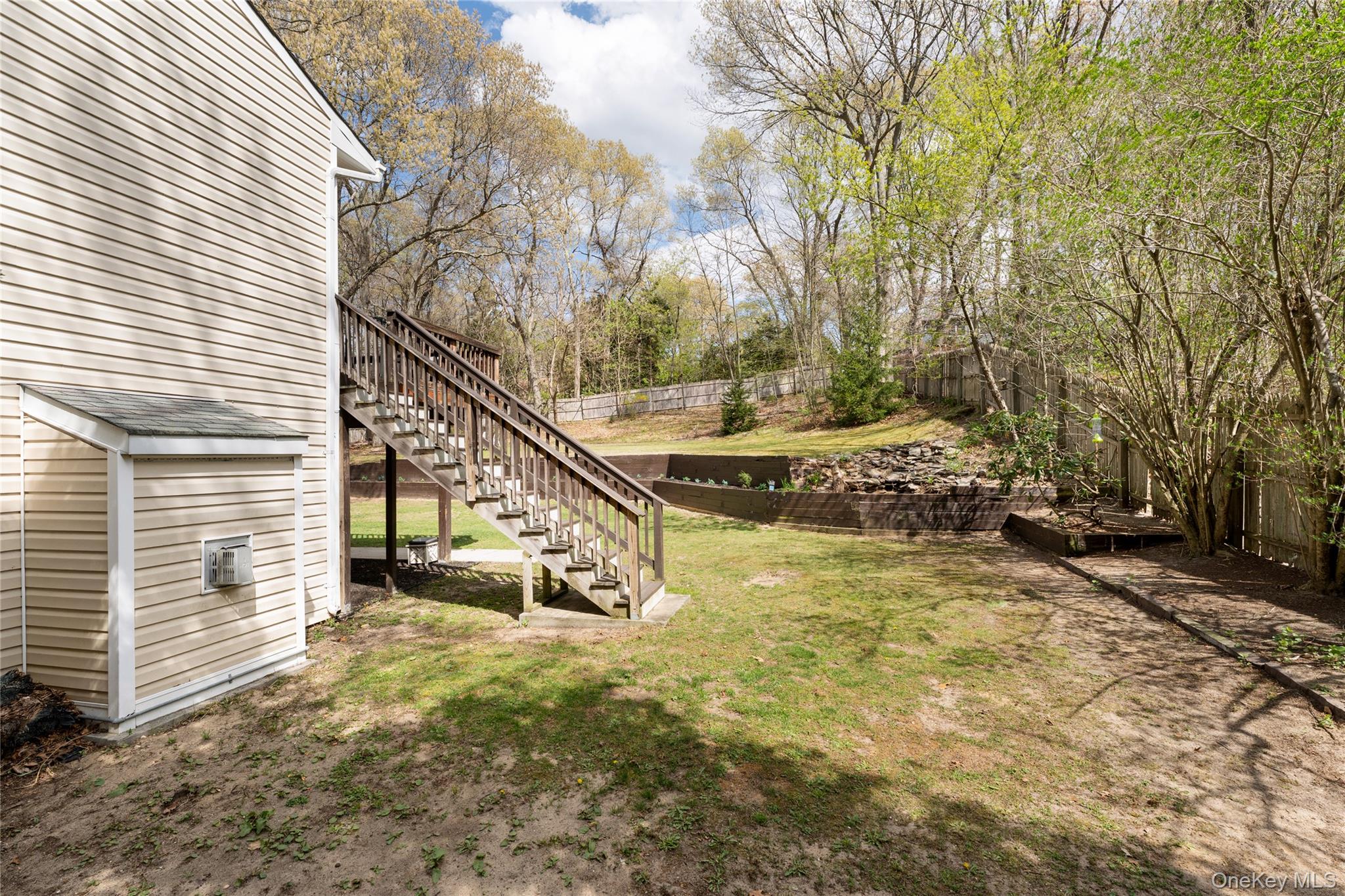 591 Meadow Road Kings Park, NY 11754 - Photo 11 of 50 a view of a house with backyard and sitting area