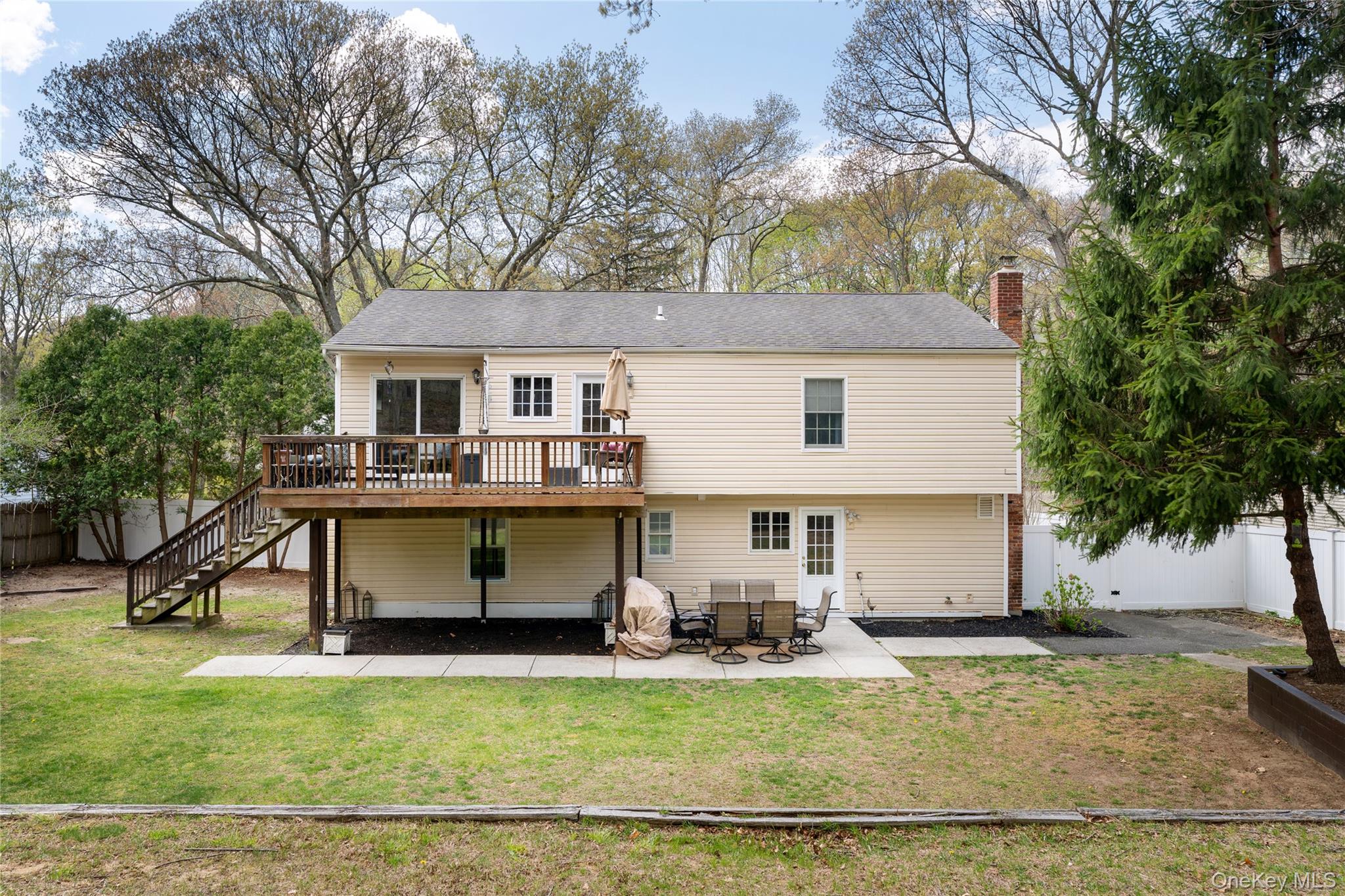 591 Meadow Road Kings Park, NY 11754 - Photo 13 of 50 a view of a house with backyard and sitting area