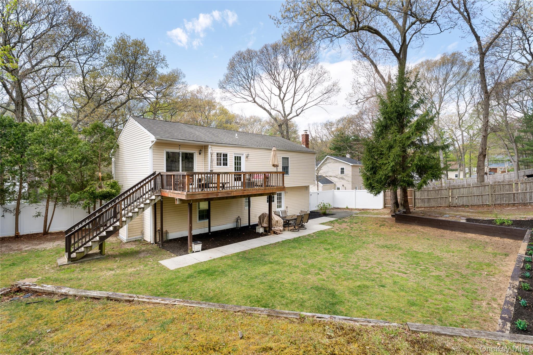 591 Meadow Road Kings Park, NY 11754 - Photo 14 of 50 a view of a house with swimming pool and sitting area