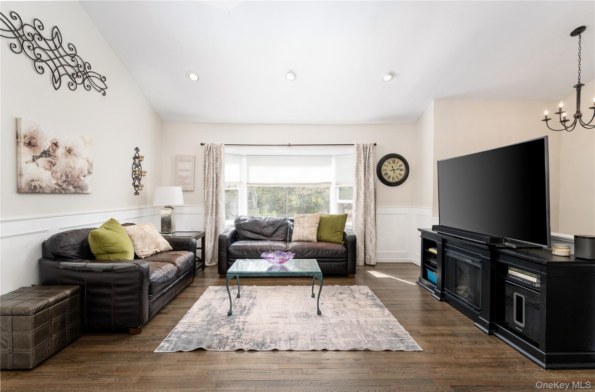 591 Meadow Road Kings Park, NY 11754 - Photo 20 of 50 a living room with furniture and a flat screen tv