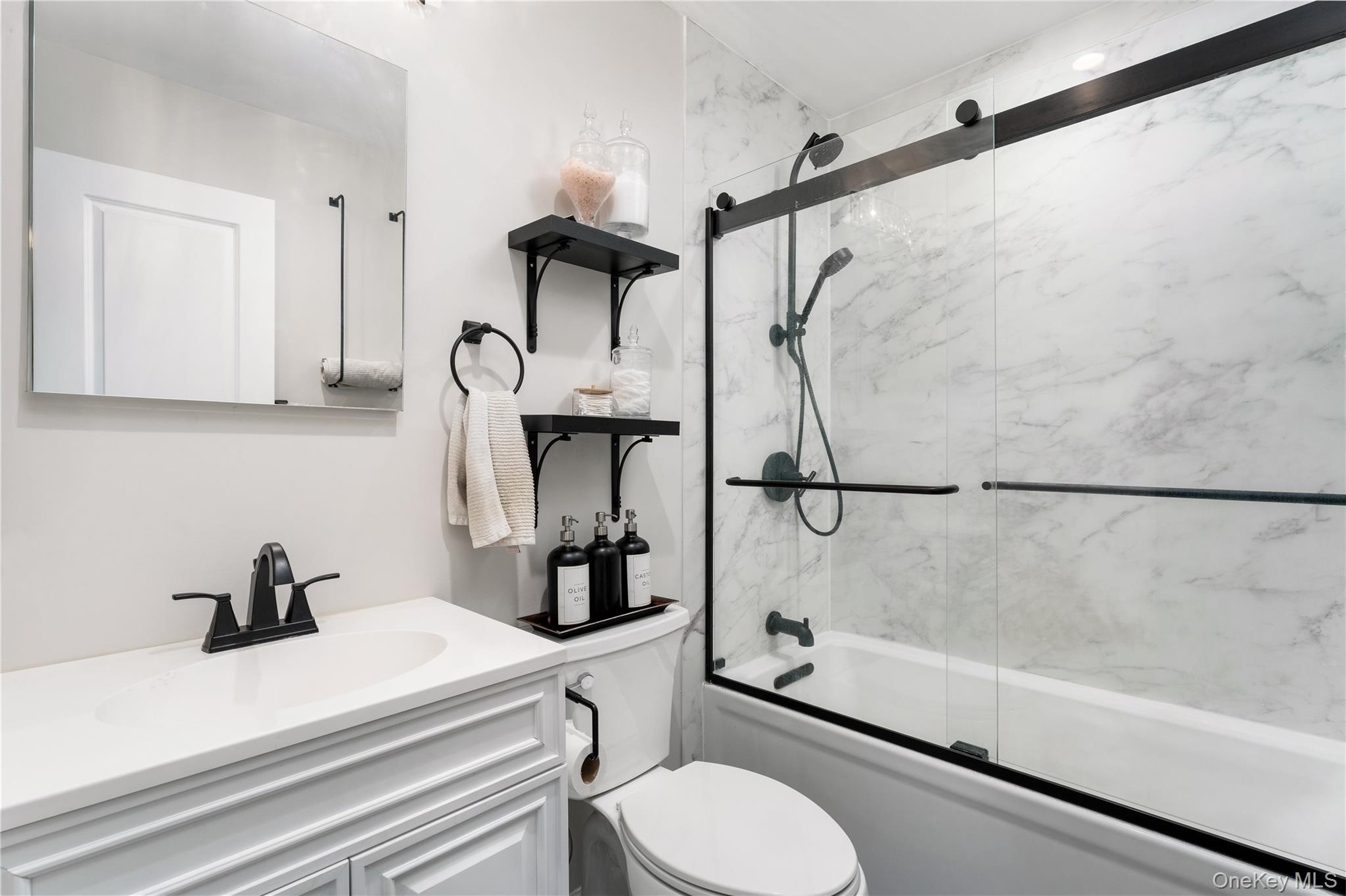 591 Meadow Road Kings Park, NY 11754 - Photo 32 of 50 a bathroom with a sink toilet and shower