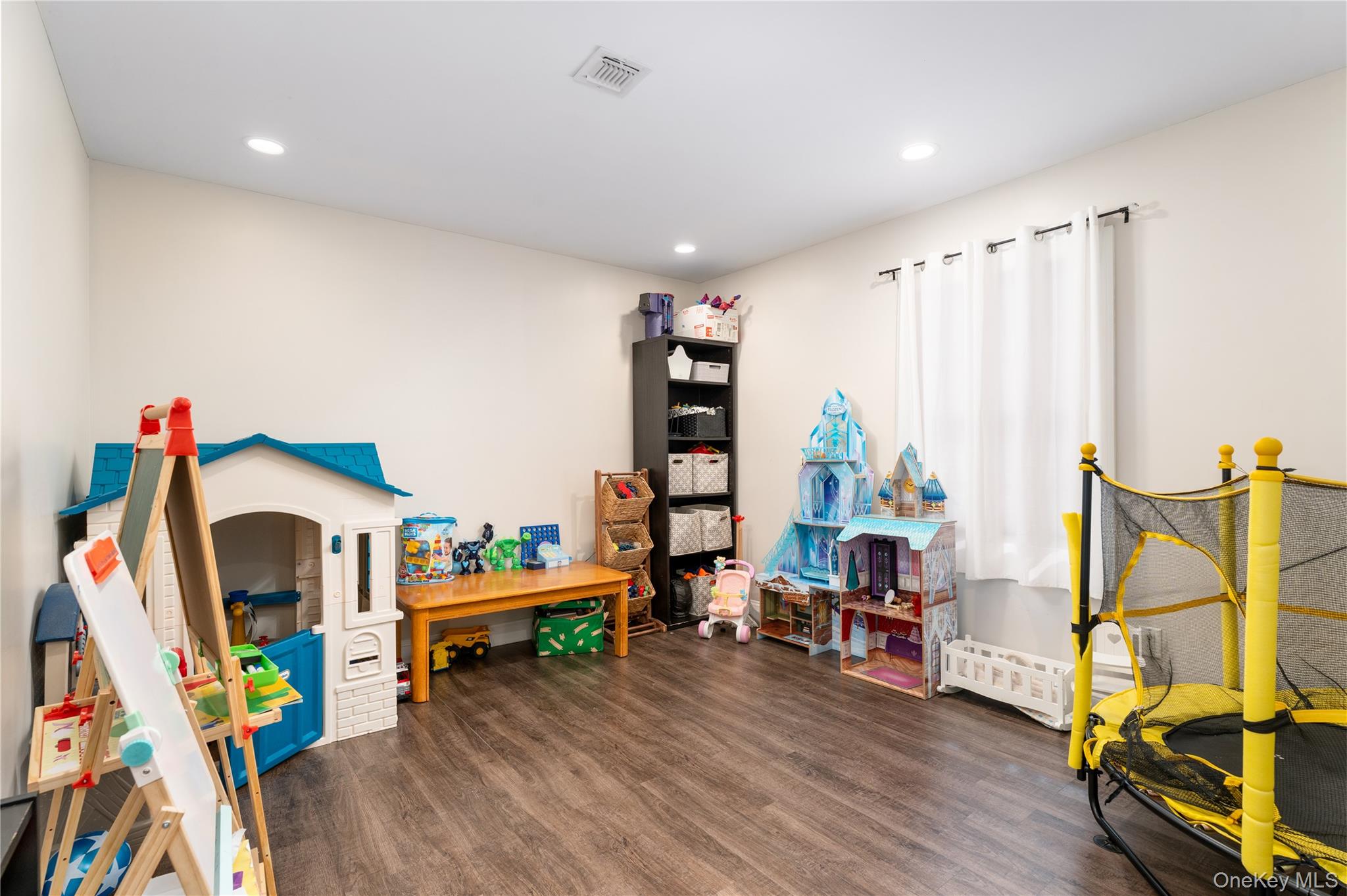 591 Meadow Road Kings Park, NY 11754 - Photo 36 of 50 a play room with furniture and wooden floor