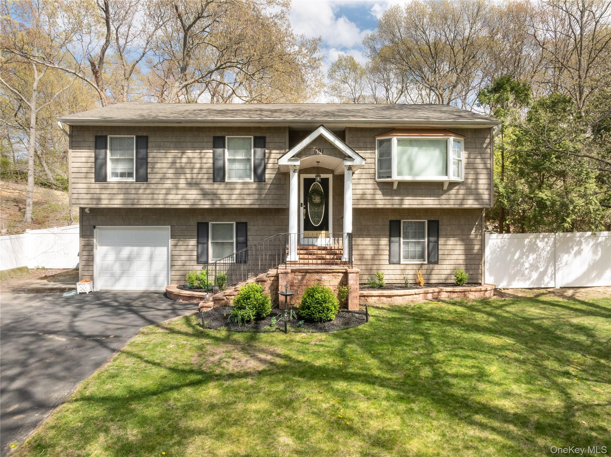 591 Meadow Road Kings Park, NY 11754 - Photo 40 of 50 a front view of a house with a yard