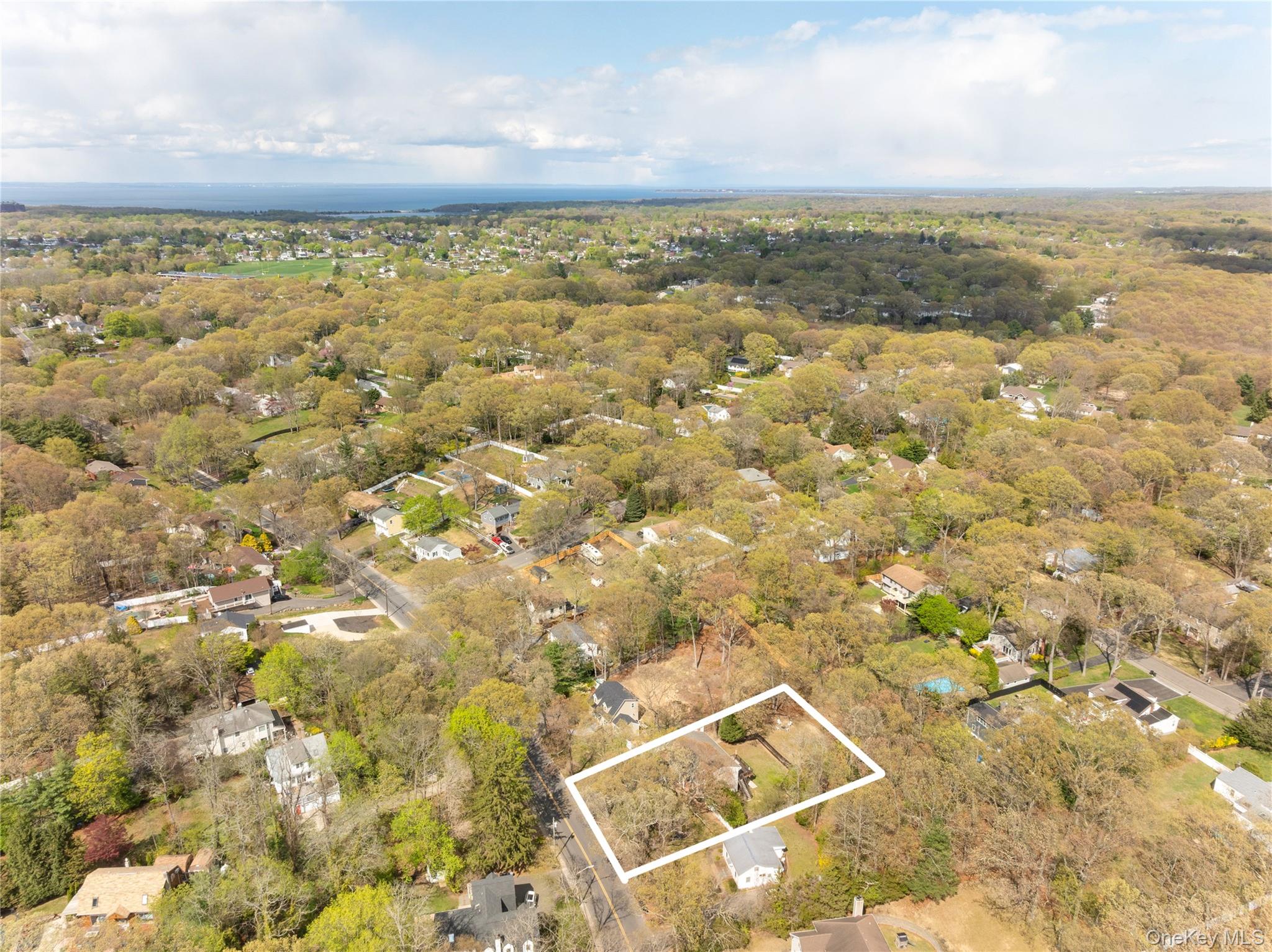 591 Meadow Road Kings Park, NY 11754 - Photo 47 of 50 an aerial view of residential houses with outdoor space