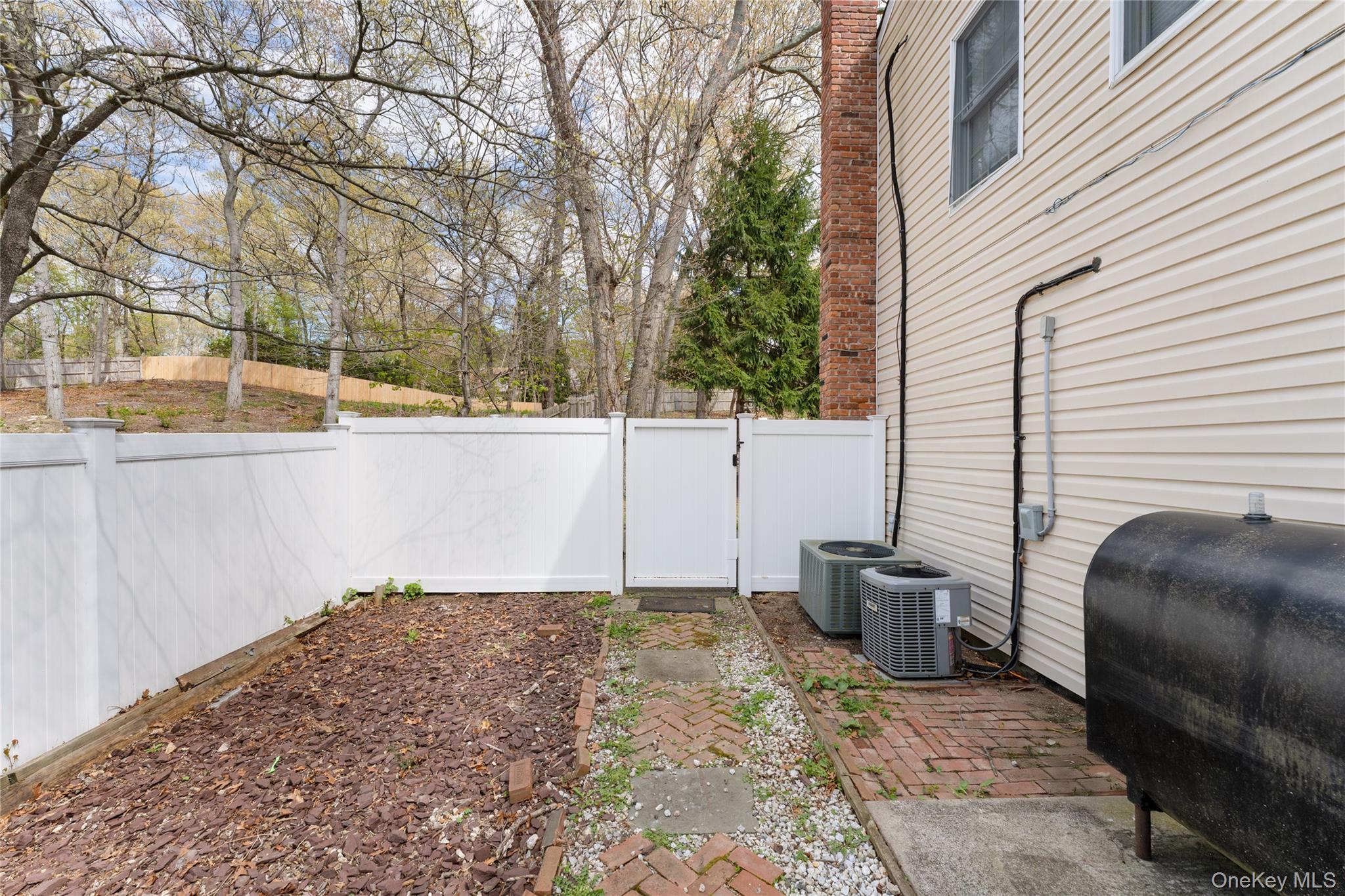 591 Meadow Road Kings Park, NY 11754 - Photo 6 of 50 a backyard of a house with seating space