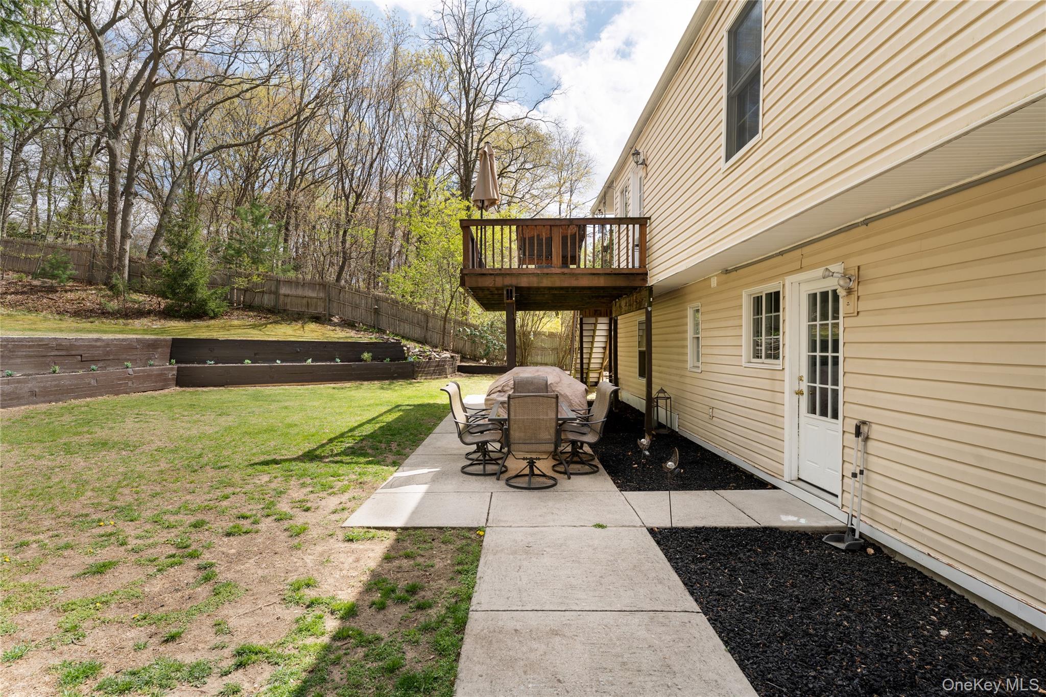 591 Meadow Road Kings Park, NY 11754 - Photo 8 of 50 a front view of a house with a garden