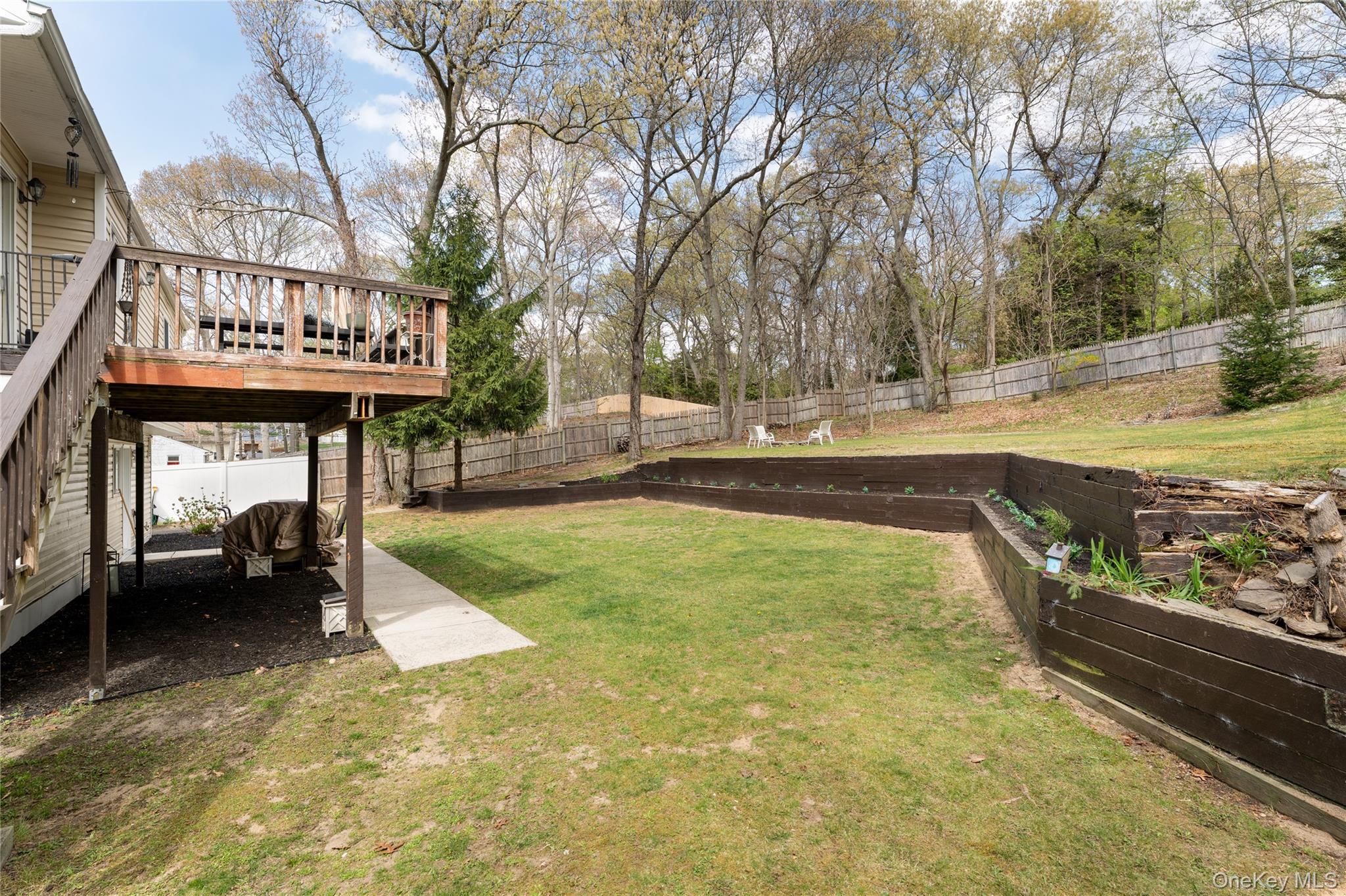 591 Meadow Road Kings Park, NY 11754 - Photo 10 of 50 a view of a swimming pool with a bench and trees
