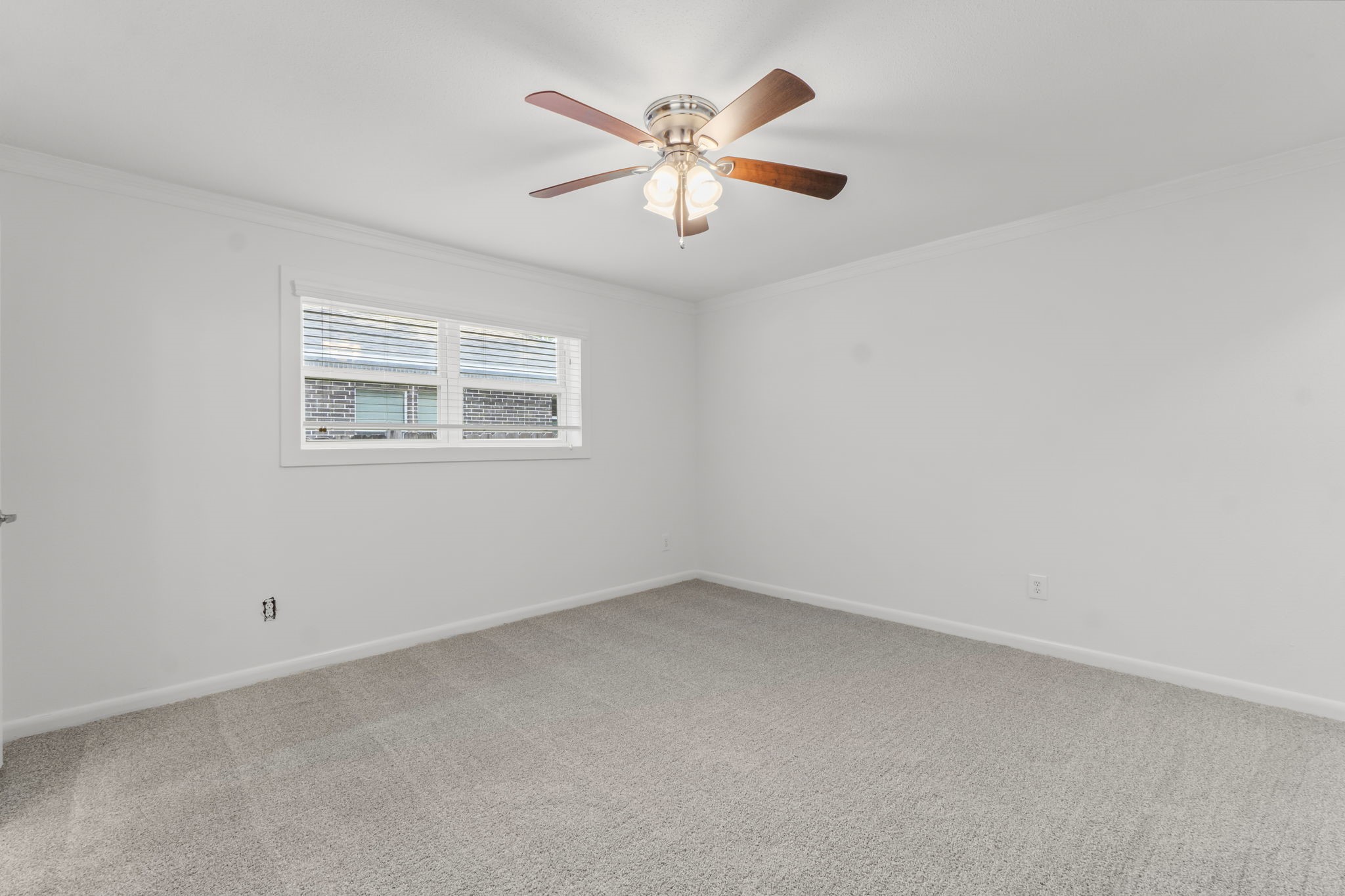 3223 Kentwood Drive Spring, TX 77380 - Photo 16 of 31 Oversized primary bedroom with plush carpeting, ceiling fan, and flexible layout options for furniture.